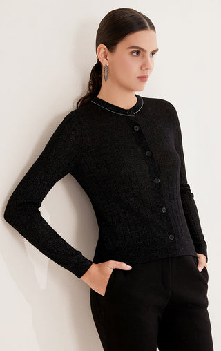 Black cardigan with button placket, rounded neckline, and subtle sparkly knit