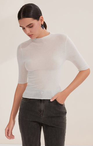 White wool blend half-sleeve knit top with crew neck; tucked-in front styling