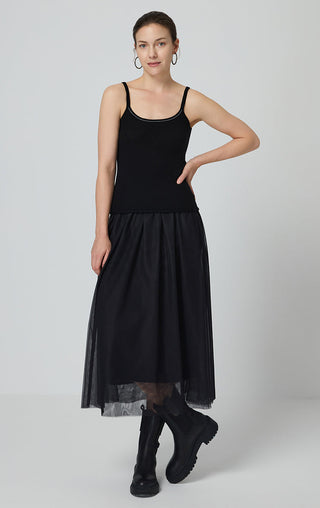 Black cashmere knit camisole with scoop neckline and contrast trim, paired with tulle skirt.
