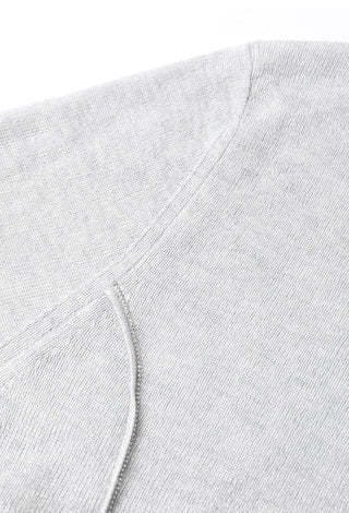 Gray-blue seam detail close-up with curved ribbed panel and stitching