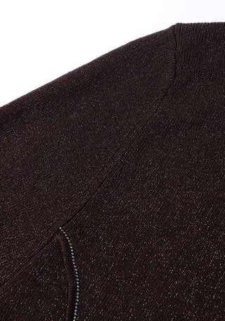 Upper side seam close-up of dark brown rib knit top with beaded trim