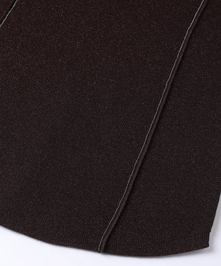 Hem close-up of dark brown rib knit top with stitched beaded seam along edge