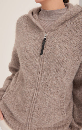 Close-up: camel cashmere-blend hooded coat with shiny zipper and patch pocket