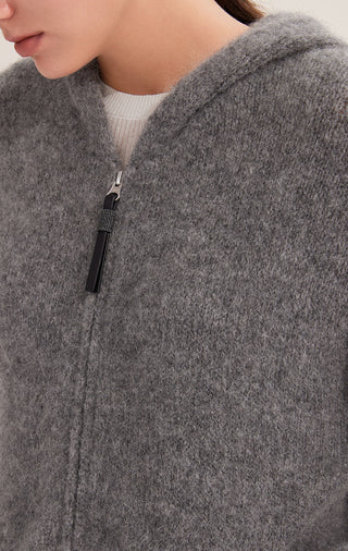 Close-up: graphite gray hooded cashmere-blend coat with shiny zipper pull