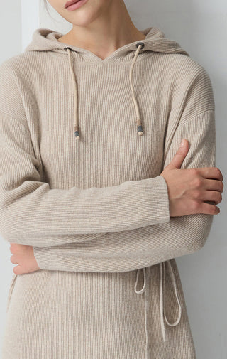 Camel hooded knit dress close-up: drawstring hood and waist tie on wool knit