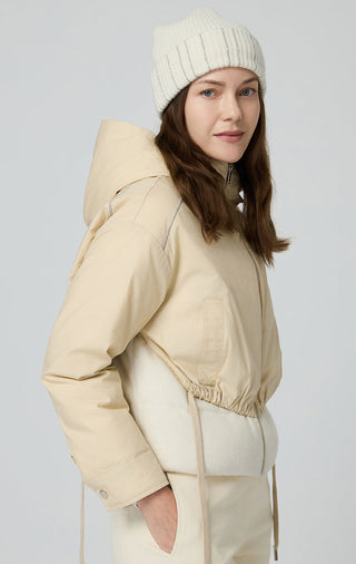 Beige hooded jacket in two-piece look, side view with zipper closure