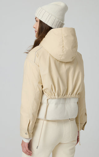 Beige back view of hooded down-style jacket with cinched waist and drawstring cuffs