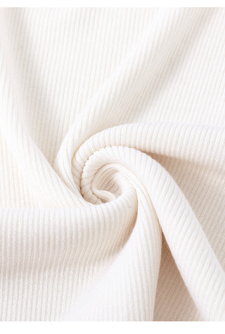 White wool-silk knit camisole fabric close-up with twisted seam