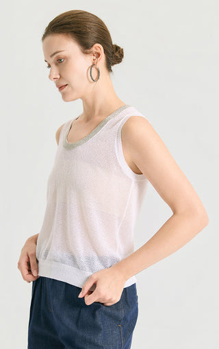 Pale pink sleeveless knit tank with gray scoop neck trim, side view