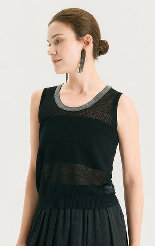 Dark sleeveless knit tank with gray scoop neck trim, model side view