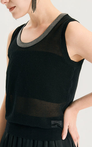 Close-up of dark knit tank with gray scoop neck trim and ribbed hem