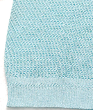 Light blue knit tank hem with ribbed bottom band
