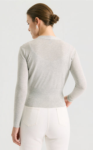 Light gray V-neck fitted short knit cardigan, button details visible (back view)
