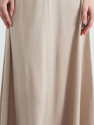 Close-up of oatmeal knit fabric on a high-waisted A-line midi skirt
