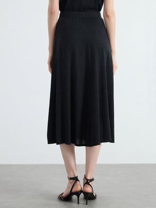 Black high-waisted A-line knit midi skirt, even drape from waist to mid-calf hem