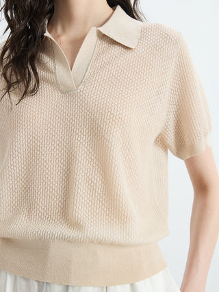 Oatmeal knit polo top close-up: pointed collar, short sleeves, ribbed hem