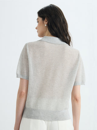 Back view of light gray open-knit short-sleeve polo with ribbed hem
