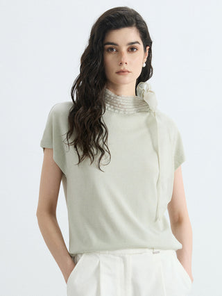 Wool-silk knit blouse in olive green with ribbed mock neck and organza bow detail
