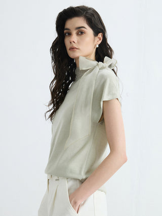 Olive green wool-silk knit blouse with organza bow and draped short sleeves