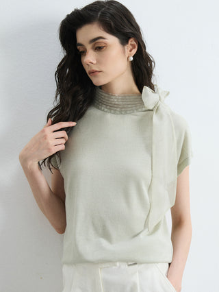 Olive green knit blouse with side-organza bow at the high mock neck collar