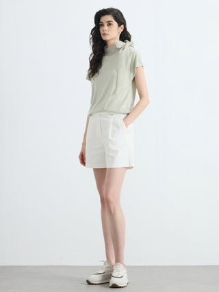 Olive green mock-neck knit blouse with organza bow and matching light shorts