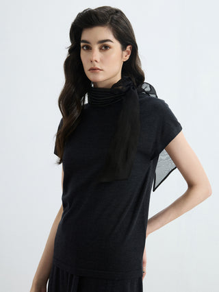 Black wool-silk knit blouse with organza bow and tiered high neckline