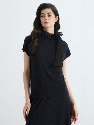 Black wool-silk knit blouse with organza bow at high neck