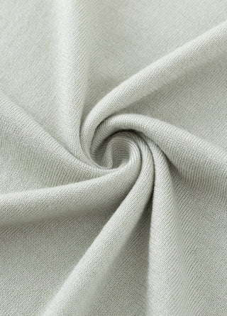 Wool-silk knit fabric texture in light ivory with fine ribbed surface