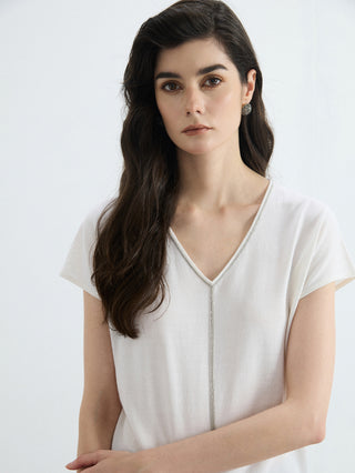 White V-neck knit top with silver bead trim down center seam and short sleeves
