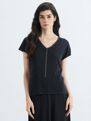 Black wool-silk knit V-neck top with silver bead trim and short sleeves