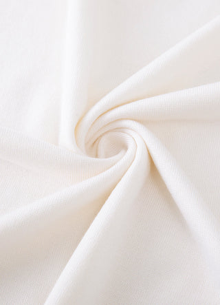 White knit fabric close-up with smooth, fine texture