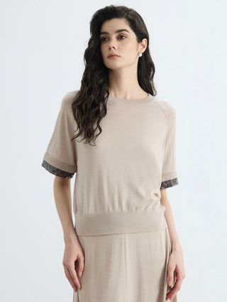 Beige wool-silk knit top with silver beaded cuffs and relaxed short sleeves