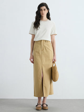 Ivory knit T-shirt with brown contrast trim, styled with khaki wide-leg pants