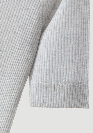 Pale taupe ribbed knit fabric detail with straight bottom hem