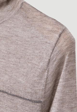 Taupe wool-blend knit turtleneck fabric close-up with subtle shimmer.