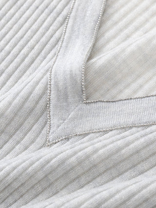 Ribbed knit V-neck sweater neckline detail in light gray