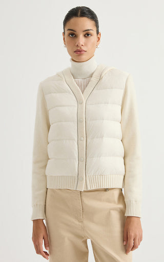 Light cream hooded puffer jacket with snap front and ribbed knit cuffs