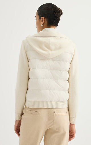 Cream hooded puffer jacket back view with quilted panels and ribbed hem
