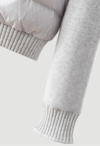 Light gray knit cuff and sleeve of hooded puffer jacket