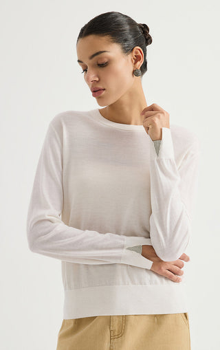 Women’s fine wool crewneck sweater in white with cuff detail and ribbed hem.