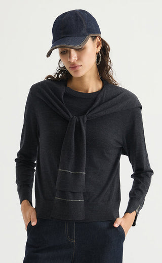 Women’s dark gray fine wool crewneck sweater with draped front and cuff detail.