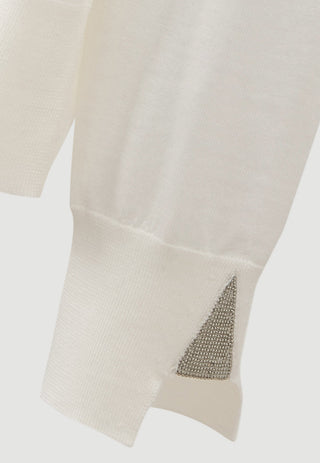White fine wool sweater sleeve cuff with beaded triangular detail