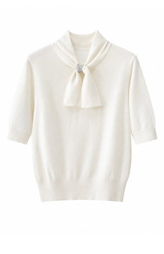 Ivory cashmere knit top with three-quarter sleeves and pussy-bow collar