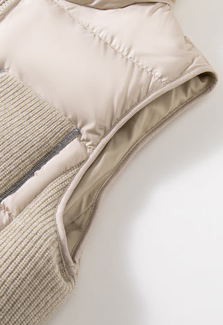 Beige puffer vest hem and ribbed pocket trim with stitched edge