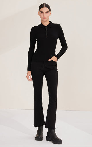 Black ribbed wool zip polo sweater with shimmer pull, full-length front view