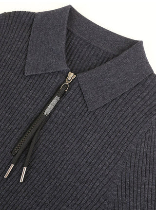 Close-up: dark ribbed wool zip polo sweater collar and shimmer pull hardware