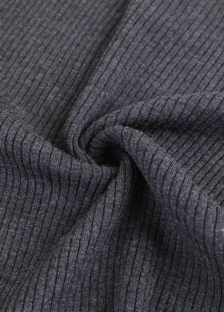 Ribbed knit cuff detail on dark wool zip polo sweater sleeve