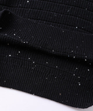 Ribbed hem of black knit pullover with fine sequins