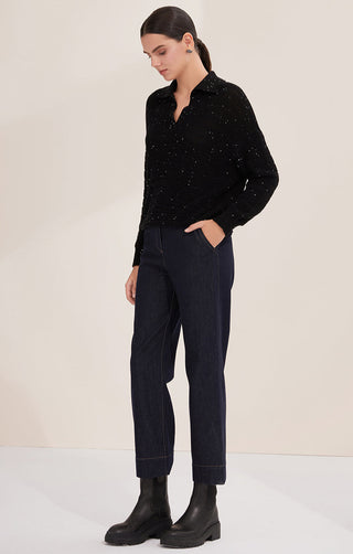 Black sequin cotton knit pullover, side view, collared V-neck and ribbed cuffs