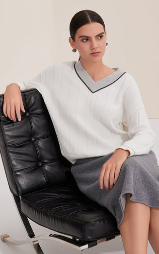 White cotton V-neck sweater with contrast edging, knit stripe texture and relaxed fit